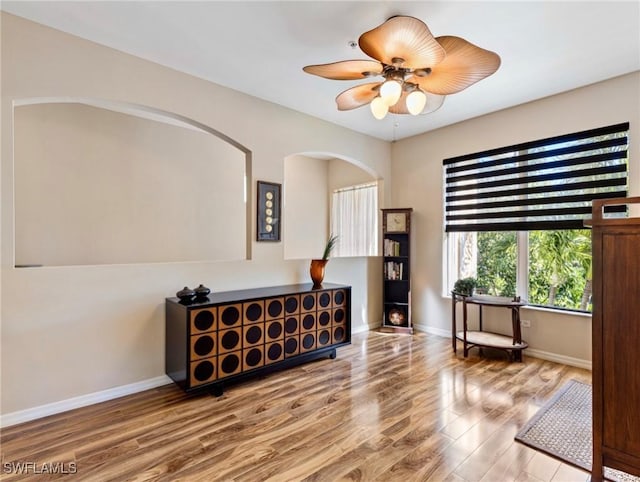 sitting room featuring ceiling fan and hardwood / wood-style flooring