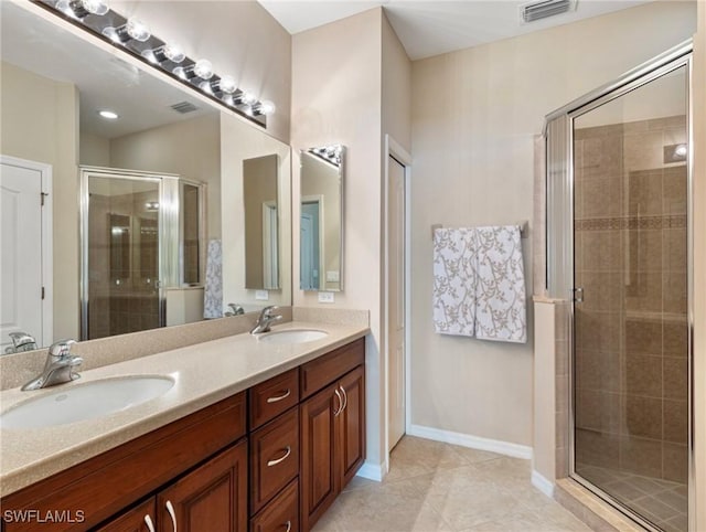 bathroom with vanity, tile patterned floors, and an enclosed shower