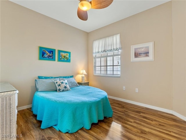 bedroom featuring ceiling fan and hardwood / wood-style flooring