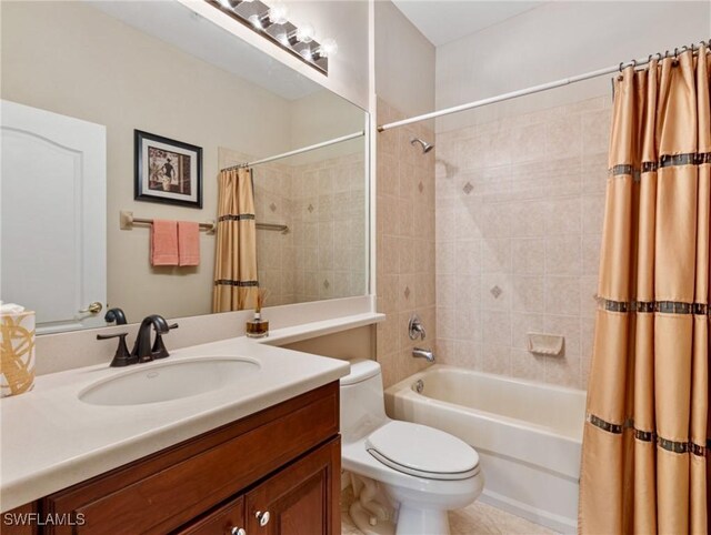 full bathroom featuring vanity, shower / bath combination with curtain, and toilet