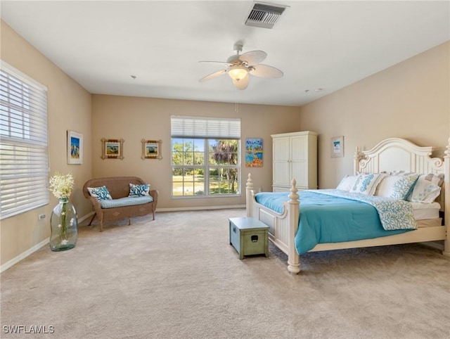 bedroom featuring light carpet and ceiling fan