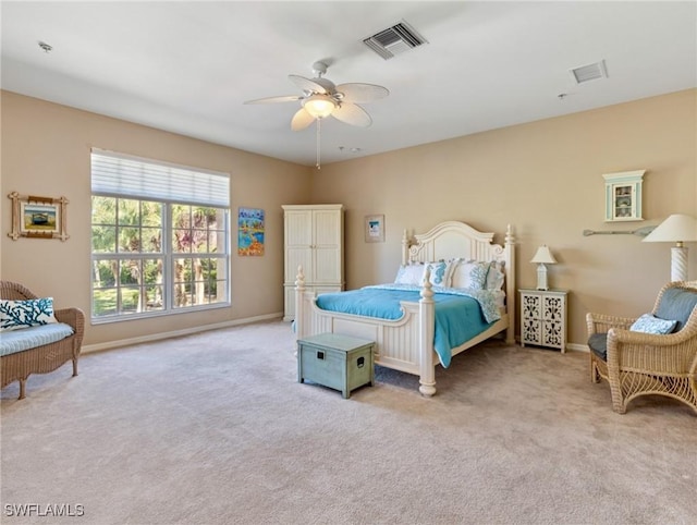 bedroom featuring ceiling fan and light carpet