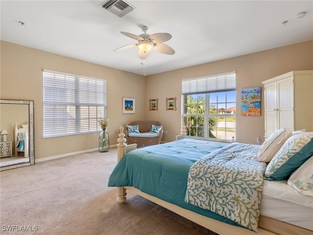 bedroom featuring ceiling fan and light colored carpet