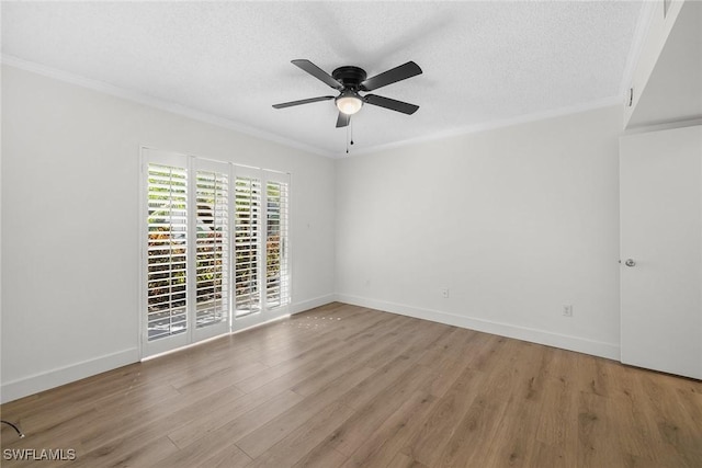 spare room with a textured ceiling, light wood-type flooring, ceiling fan, and crown molding