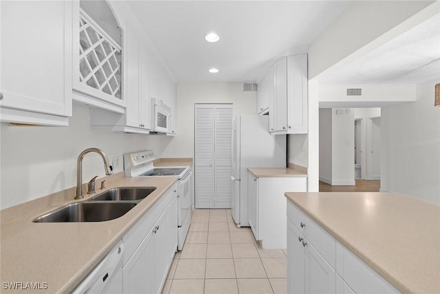 788 Park Shore Dr Unit B17, Naples, FL 34103 - kitchen with white appliances, a sink, white cabinets, recessed lighting, and light countertops