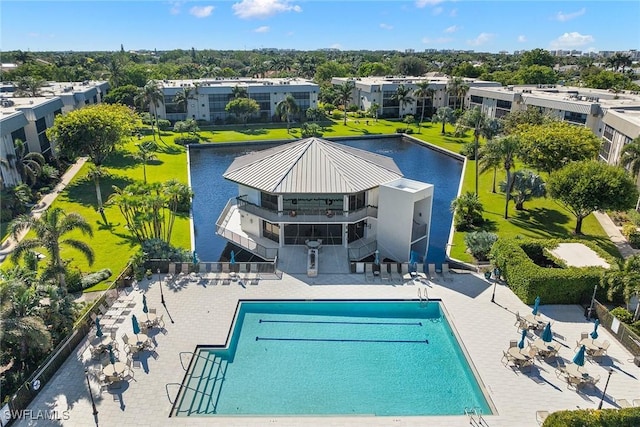 view of swimming pool featuring a water view