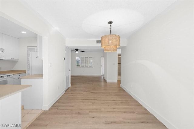788 Park Shore Dr Unit B17, Naples, FL 34103 - unfurnished dining area with light wood-type flooring, a ceiling fan, baseboards, a chandelier, and recessed lighting