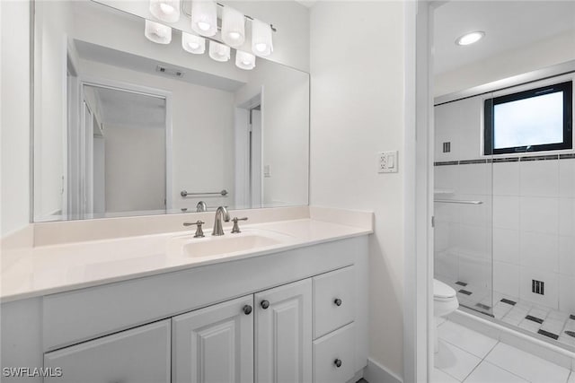 bathroom featuring tile patterned floors, walk in shower, vanity, and toilet