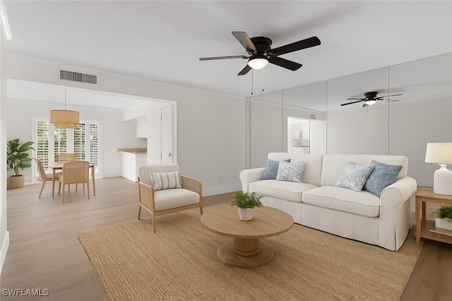 788 Park Shore Dr Unit B17, Naples, FL 34103 - living area with ceiling fan and light wood finished floors