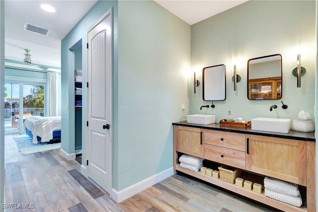 bathroom with vanity and wood-type flooring