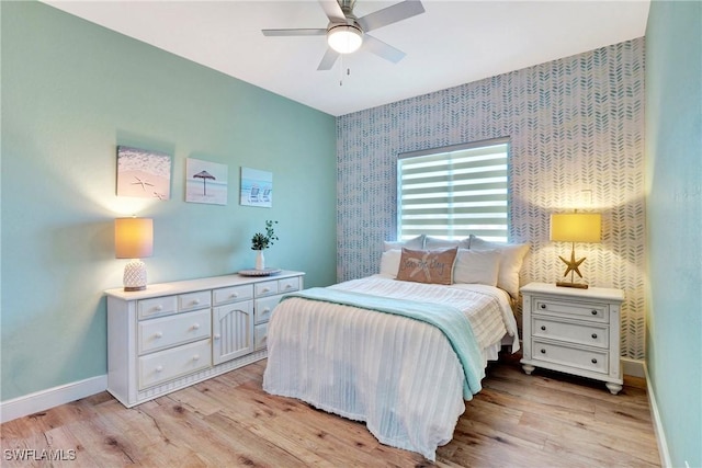 bedroom featuring light wood-type flooring and ceiling fan