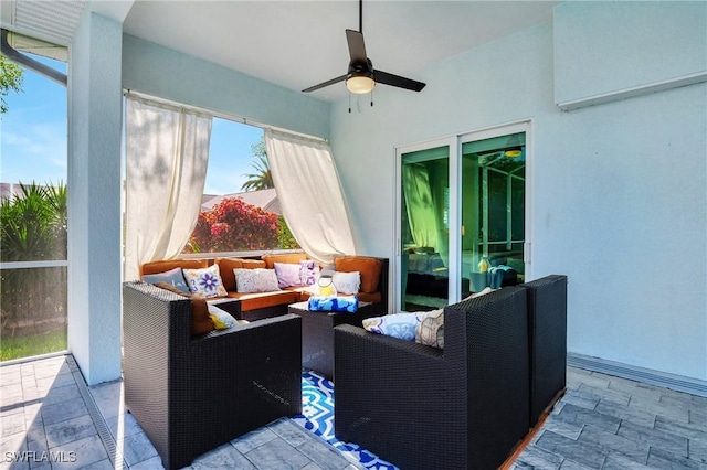 view of patio with ceiling fan and an outdoor hangout area