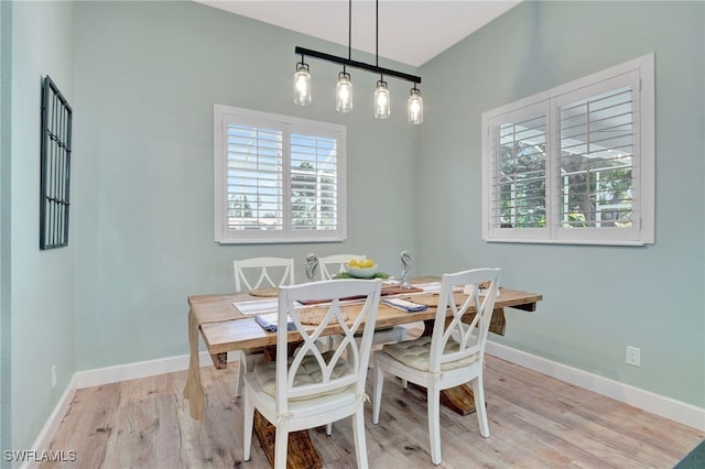 dining space featuring light wood-type flooring