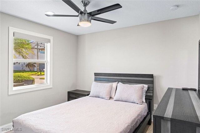 bedroom featuring baseboards and a ceiling fan