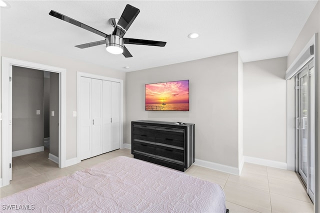 tiled bedroom featuring ceiling fan