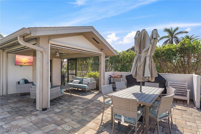 view of patio featuring an outdoor living space and ceiling fan