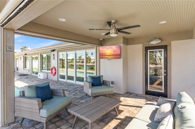 view of patio / terrace with an outdoor living space and ceiling fan