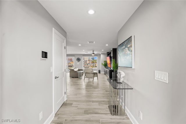 hallway with light wood-type flooring