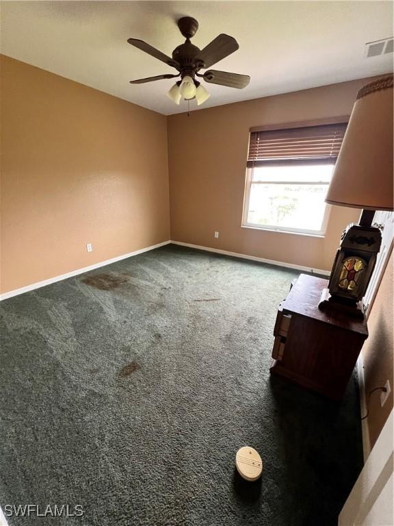 interior space featuring ceiling fan