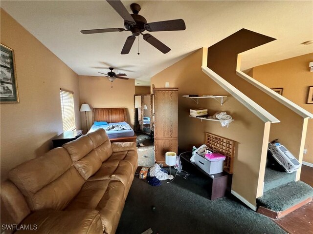 living room featuring ceiling fan and lofted ceiling