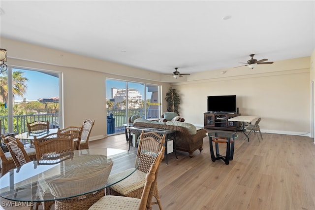 dining area featuring ceiling fan and light hardwood / wood-style floors