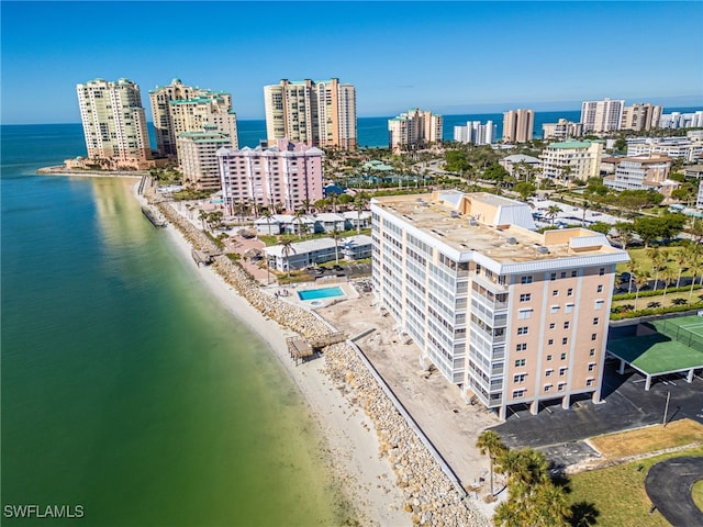 bird's eye view featuring a water view and a view of the beach