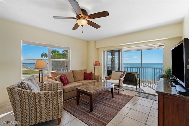 tiled living room featuring ceiling fan