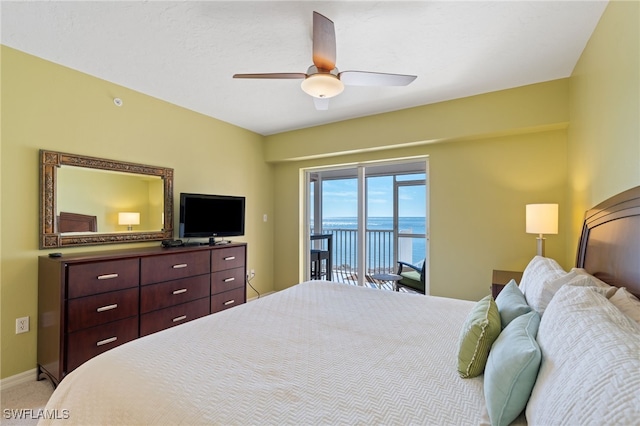 bedroom featuring carpet, ceiling fan, and access to outside