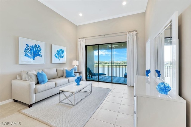 living room with light tile patterned floors and crown molding