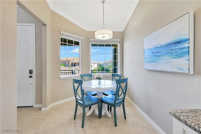 tiled dining space with ornamental molding