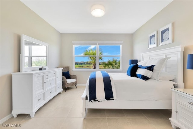 bedroom with light tile patterned flooring