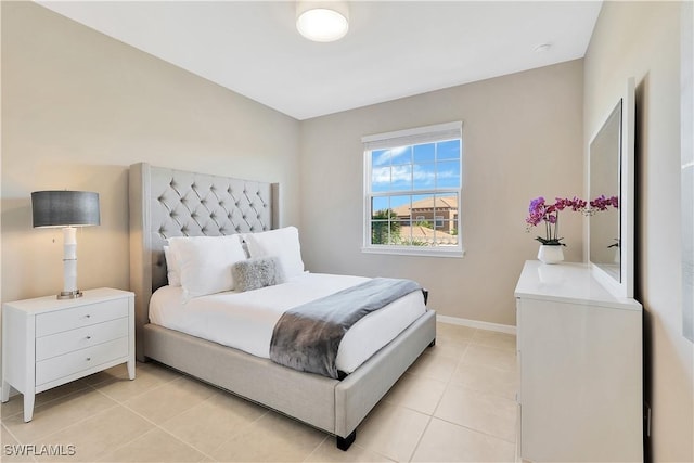 bedroom with light tile patterned floors