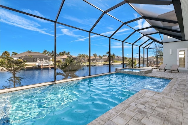 view of swimming pool featuring glass enclosure, an in ground hot tub, a water view, and a patio