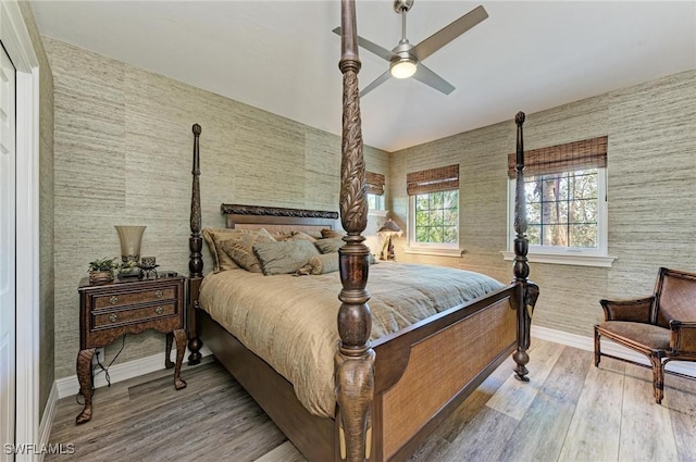 bedroom featuring light wood-type flooring and ceiling fan