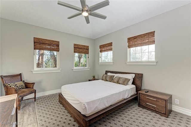 bedroom with multiple windows, ceiling fan, and light hardwood / wood-style flooring