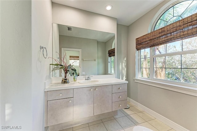 bathroom with tile patterned flooring and vanity