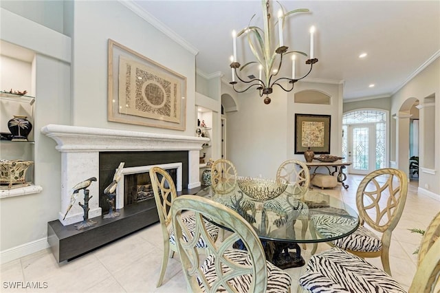 dining area with french doors, light tile patterned floors, and ornamental molding