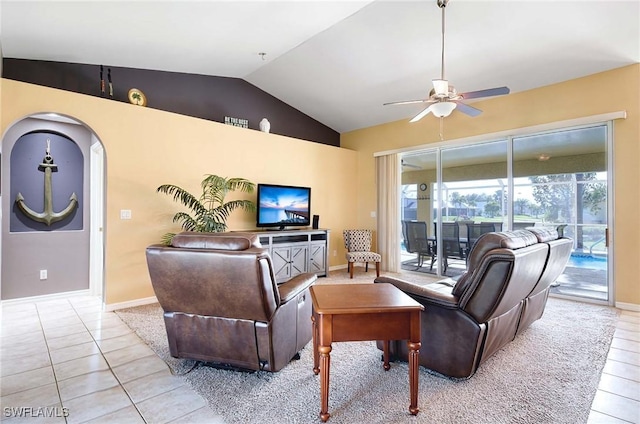 living room with ceiling fan, light tile patterned flooring, and lofted ceiling