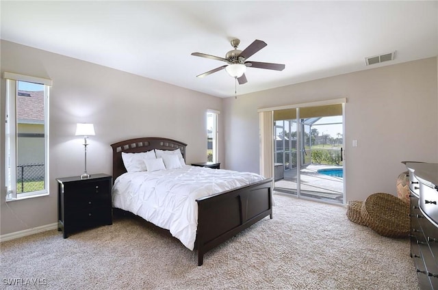 bedroom featuring access to exterior, light carpet, and ceiling fan