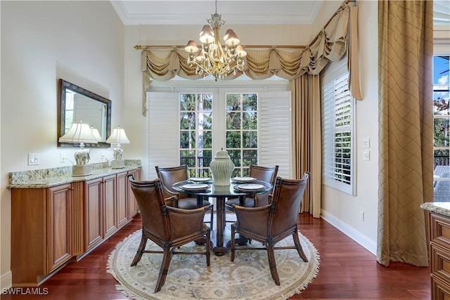 dining area featuring a chandelier, dark hardwood / wood-style floors, and crown molding