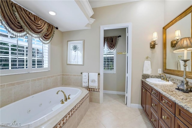 bathroom with tile patterned flooring, vanity, a relaxing tiled tub, and plenty of natural light