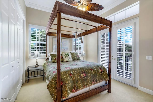 bedroom featuring ceiling fan, access to exterior, crown molding, and light carpet