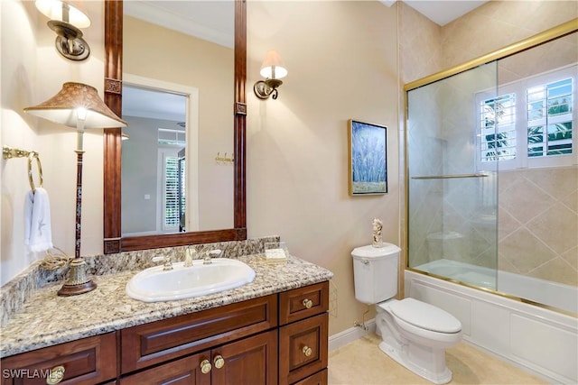 full bathroom with tile patterned floors, plenty of natural light, vanity, and bath / shower combo with glass door