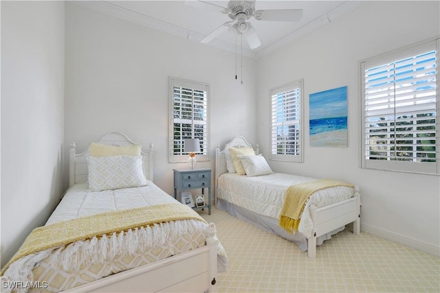 bedroom with carpet flooring, ceiling fan, and ornamental molding