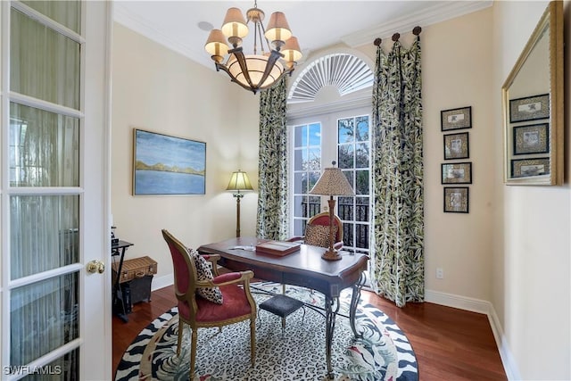 office space with an inviting chandelier, dark hardwood / wood-style flooring, crown molding, and french doors