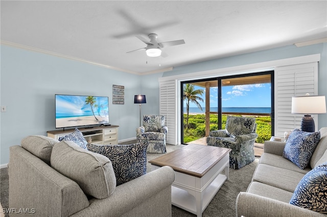 carpeted living room featuring ceiling fan and ornamental molding