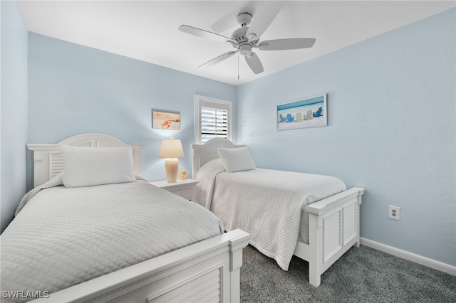 bedroom featuring ceiling fan and dark colored carpet