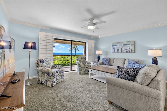 carpeted living room with ceiling fan and crown molding