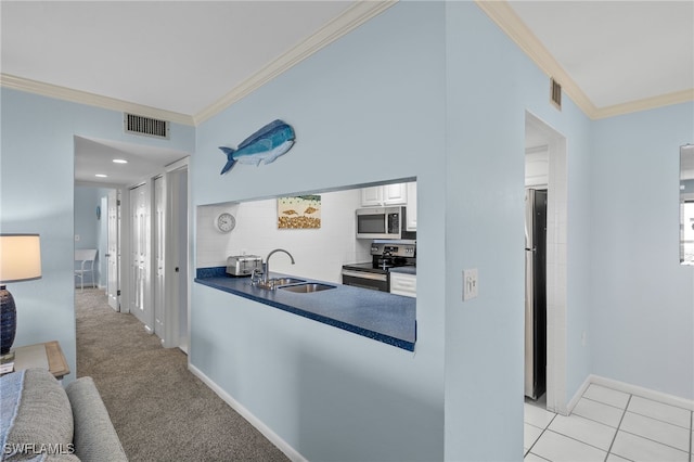 kitchen with crown molding, sink, light colored carpet, and stainless steel appliances