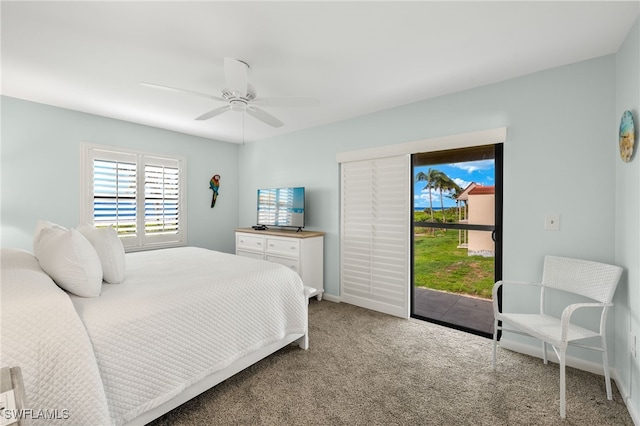 bedroom featuring access to outside, ceiling fan, and carpet flooring